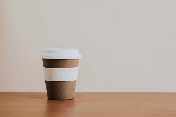 istock Cork reusable coffee cup on wooden table 2158517312