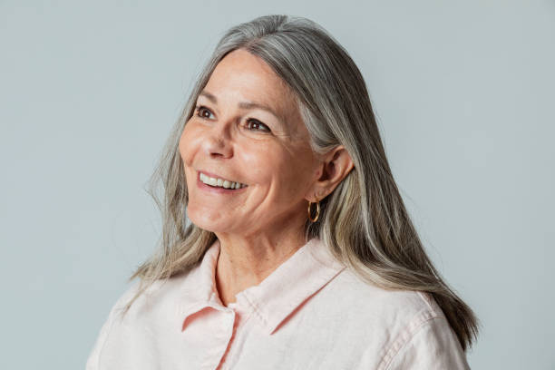 istock Happy senior woman in a studio shoot 2158517442