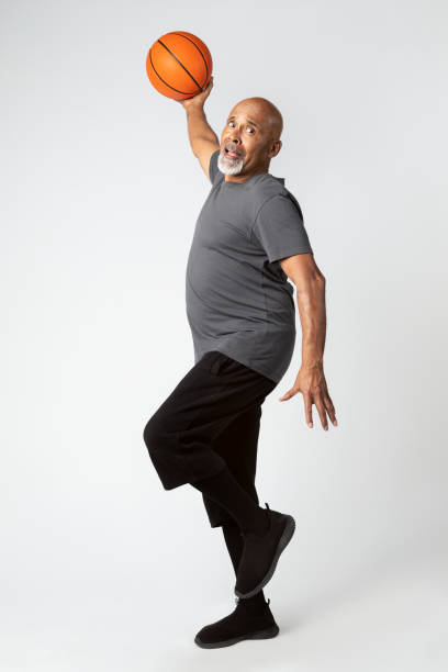 istock Retired man playing basketball 2158518404