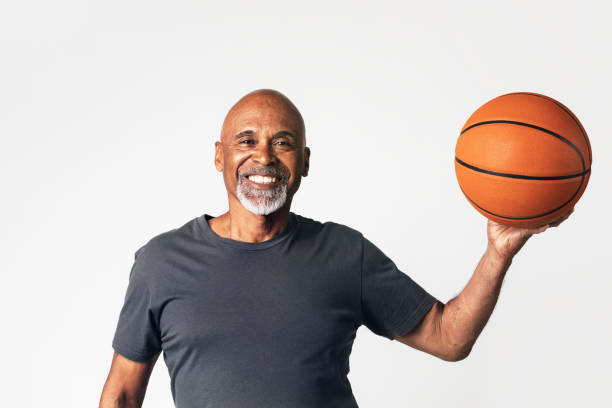 Senior coach holding a basketball