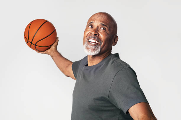 istock Senior coach holding a basketball 2158518635