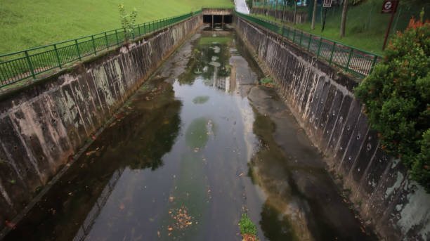 istock an old storm water canal with low water level during summer time 2158519372