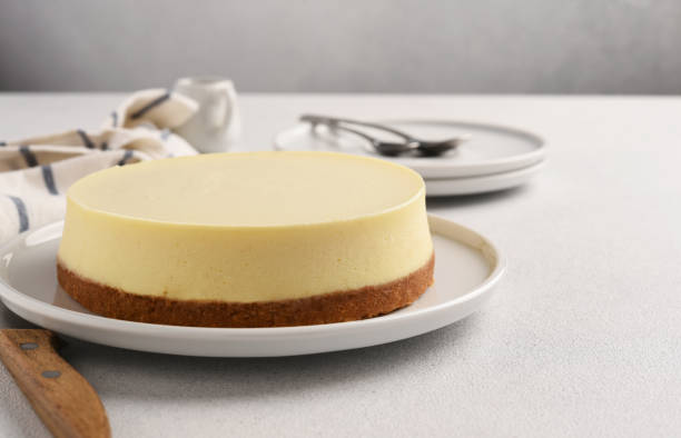 istock Delicate New York cheesecake on a light concrete background 2158521997