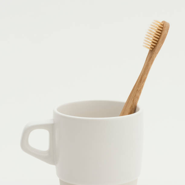 istock Natural bamboo toothbrushe      in a cup 2158524630