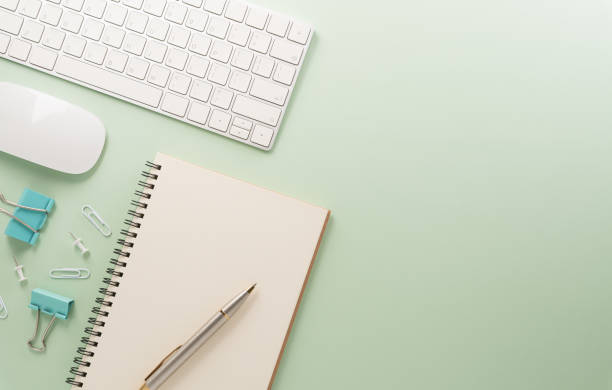 istock Flat lay, top view office table desk. Workspace with keyboard, office supplies and flower on pastel background. 2158525008