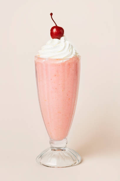 istock Strawberry milkshake with a maraschino cherry on top 2158527405
