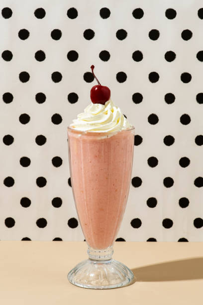istock Strawberry milkshake with a maraschino cherry on top 2158527440
