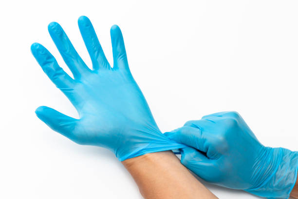 istock A man's hand in a rubber glove. 2158529402