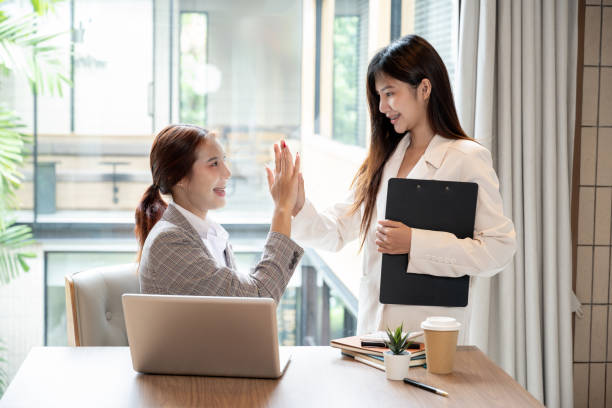 istock businesswomen or female office workers are checking the documents, having a meeting 2158530358