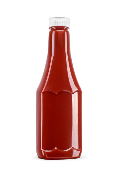 Ketchup or tomato sauce in transparent plastic bottle isolated on a white background.