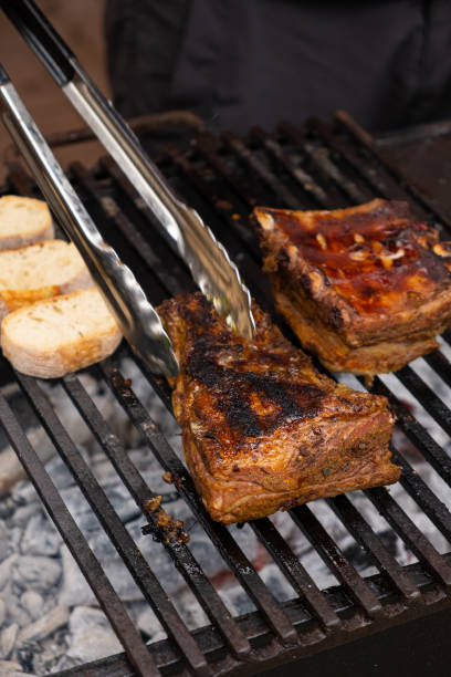 istock Marinated pork ribs are cooked on the coals of a barbecue 2158533021