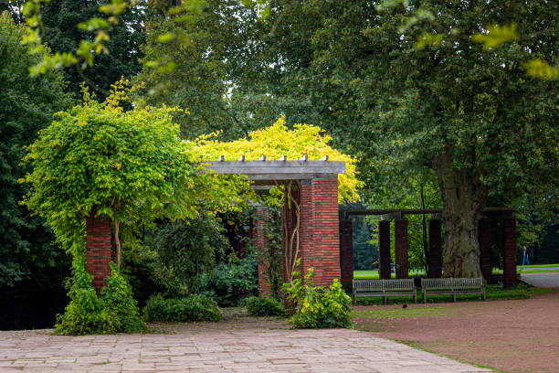 istock A beautiful park scenery with red brick pavillion and trees. 2158533121