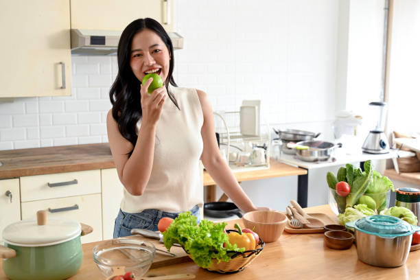istock woman enjoying cooking in the kitchen 2158533173