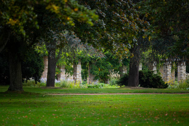 istock A beautiful park landscape with a stone brick pavillion and blooming plants. 2158533276