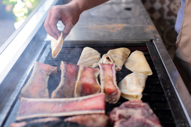 istock Man places quesadillas on the grill 2158533425