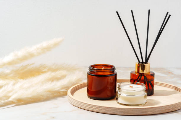 istock Scented Candles and Reed Diffuser on a Wooden Tray 2158536024