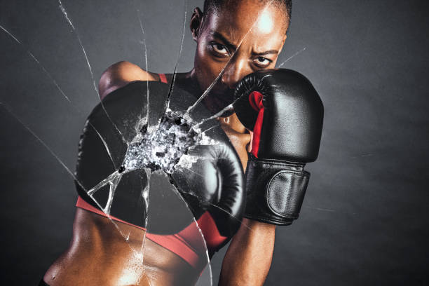 istock Shattered glass effect with female boxer 2158537587