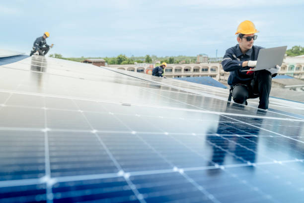 istock engineer man inspects construction of solar cell panel or photovoltaic cell by electronic device. Industrial Renewable energy of green power. factory worker working on tower roof. 2158537757