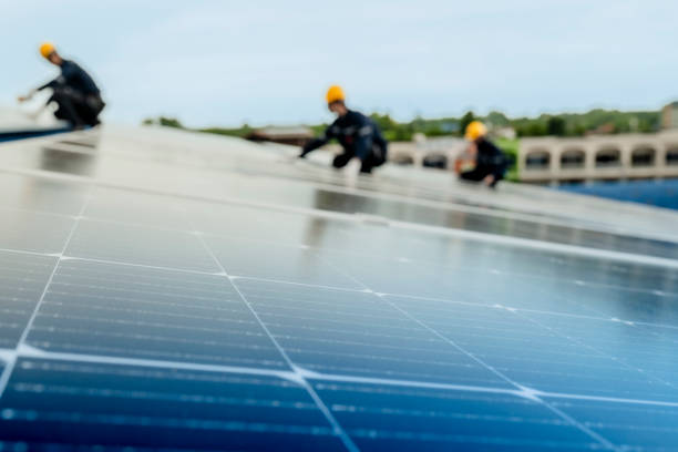 istock engineer man inspects construction of solar cell panel or photovoltaic cell by electronic device. Industrial Renewable energy of green power. factory worker working on tower roof. 2158537806