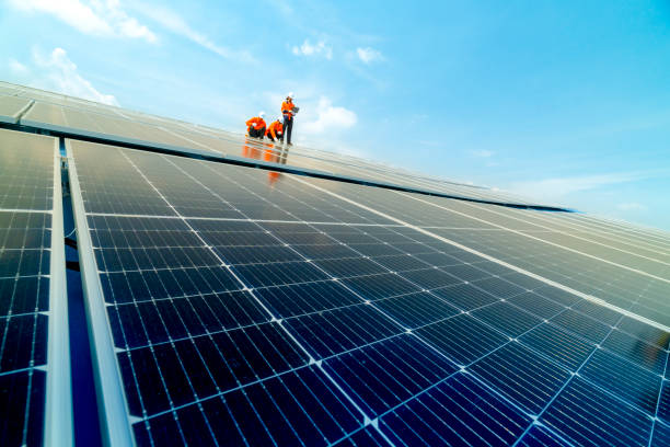 istock engineer man inspects construction of solar cell panel or photovoltaic cell by electronic device. Industrial Renewable energy of green power. factory worker working on tower roof. 2158538035