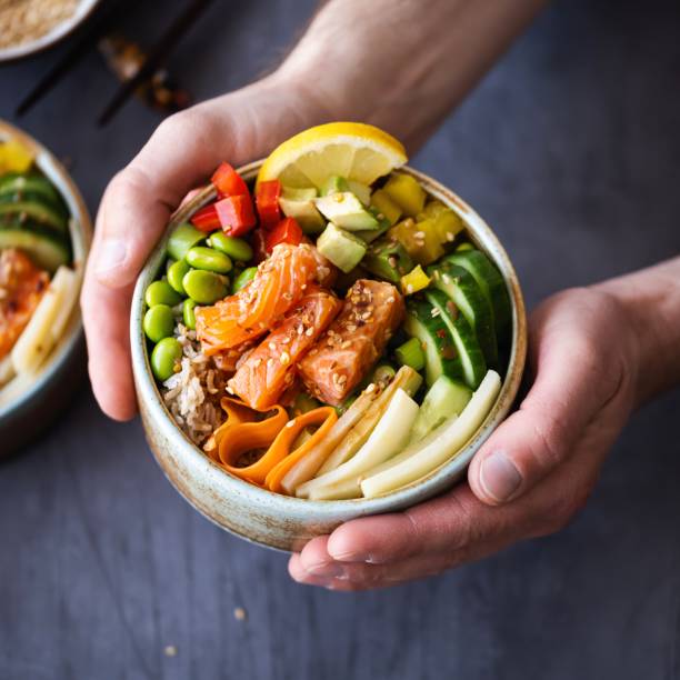 istock Salmon with vegetables on rice photography 2158538055