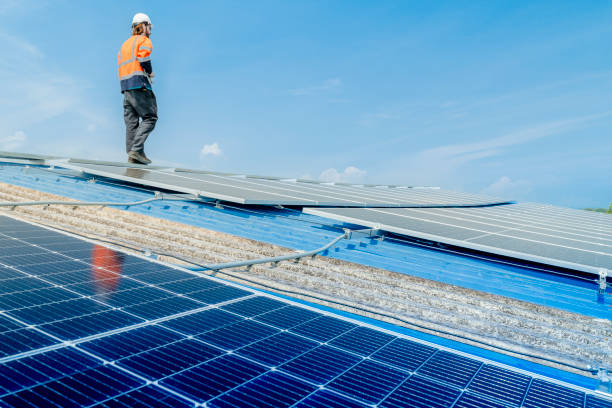 istock engineer man inspects construction of solar cell panel or photovoltaic cell by electronic device. Industrial Renewable energy of green power. factory worker working on tower roof. 2158538313
