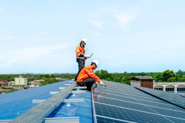 istock engineer man inspects construction of solar cell panel or photovoltaic cell by electronic device. Industrial Renewable energy of green power. factory worker working on tower roof. 2158538450