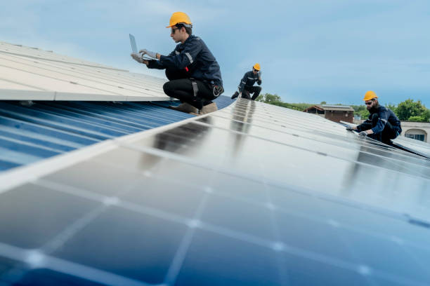 istock engineer man inspects construction of solar cell panel or photovoltaic cell by electronic device. Industrial Renewable energy of green power. factory worker working on tower roof. 2158538777