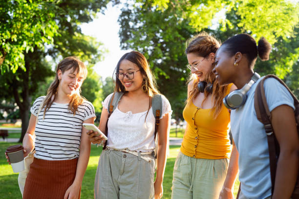 istock Modern multiracial female University students using mobile phone 2158539058