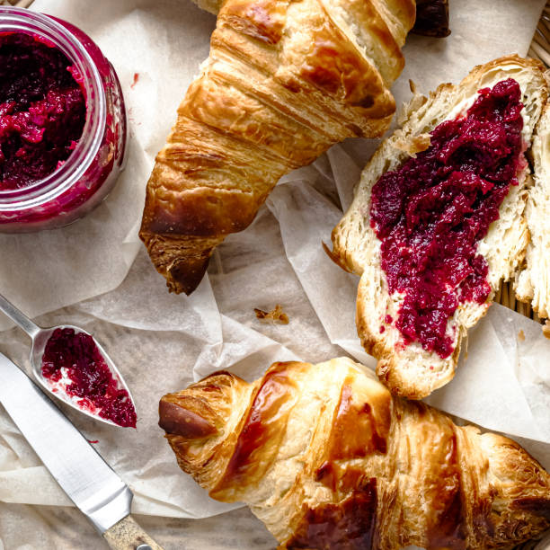 istock Breakfast set flat lay with croissant and raspberry jam food photography 2158539665