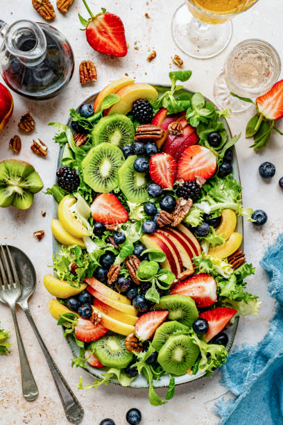 istock Healthy veggie and fruit salad flat lay topped with blueberries 2158539676
