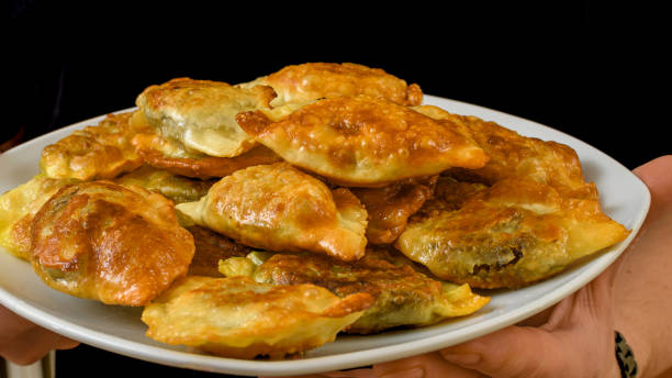 istock Fried dumplings with meat lie on a plate 2158539764