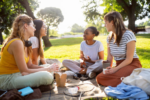 istock Multiracial female University students enjoying the picnic 2158539939
