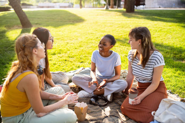 istock Multiracial female University students enjoying the picnic 2158540028