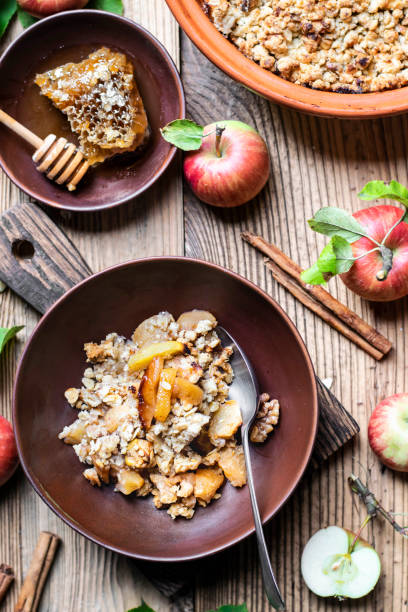 istock Home recipe apple crumble on wooden table flat lay 2158542091