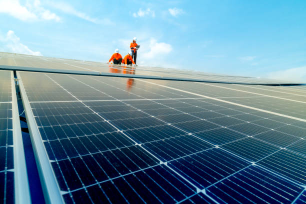 istock engineer man inspects construction of solar cell panel or photovoltaic cell by electronic device. Industrial Renewable energy of green power. factory worker working on tower roof. 2158542550