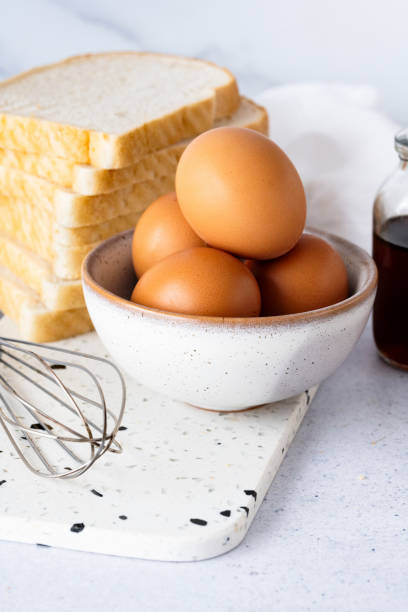 French toast breakfast preparation ingredients with eggs and bread
