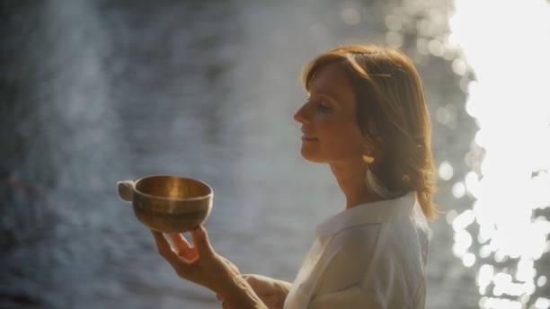 istock Serene Woman Engages in Riverside Meditation Practice 2158543043