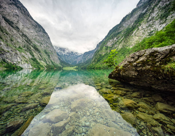 istock Crystal clear Lake Obersee under a overcast sky 2158544290