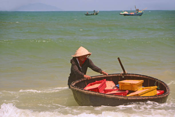 Water taxis are the quickest and easiest way to cross The Thu Bon River in Hoi An, Vietnam.