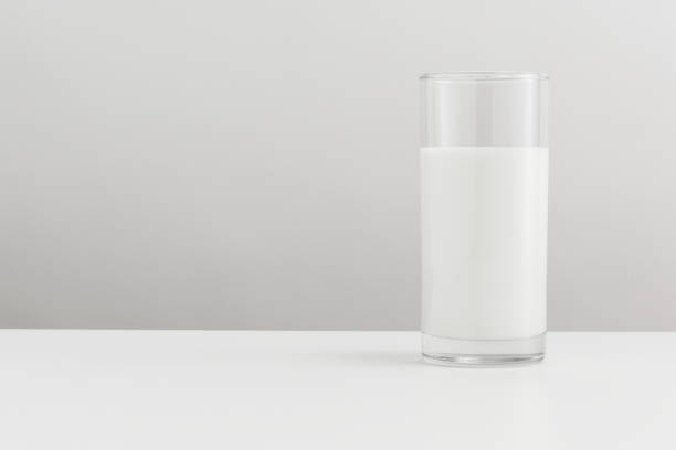 istock Fresh milk in a glass on a table banner 2158545097