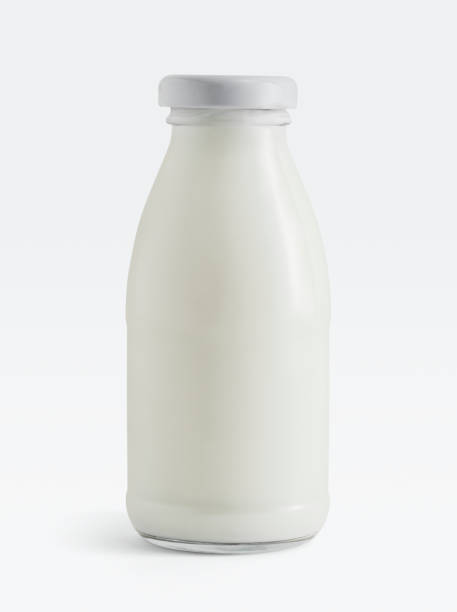 istock Fresh milk in a glass bottle on white background 2158545132