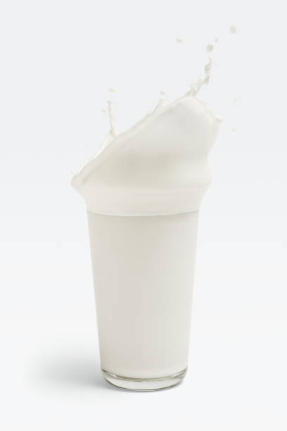 istock Fresh milk splashing from a glass 2158545181