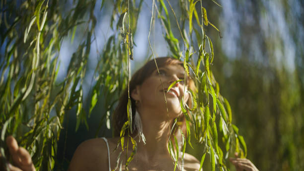 portrait of a girl in a white dress in a summer forest
