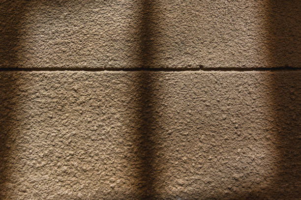 Shadow of window on wall at sunrise.