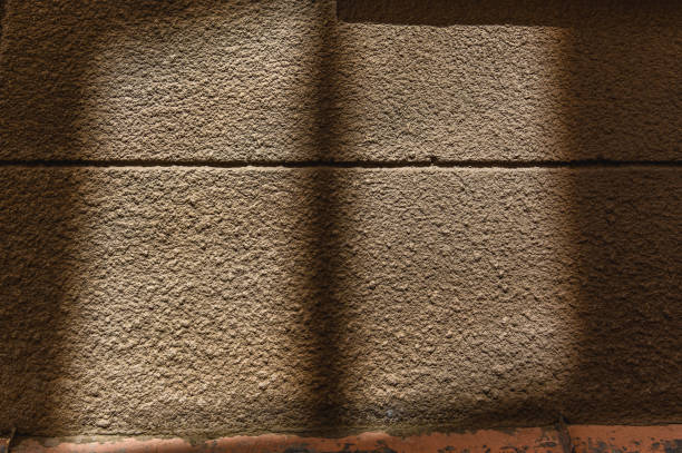 High contrast stone wall texture background.
