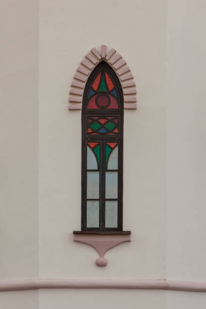 istock A Gothic-style window with multicolored stained glass 2158547115