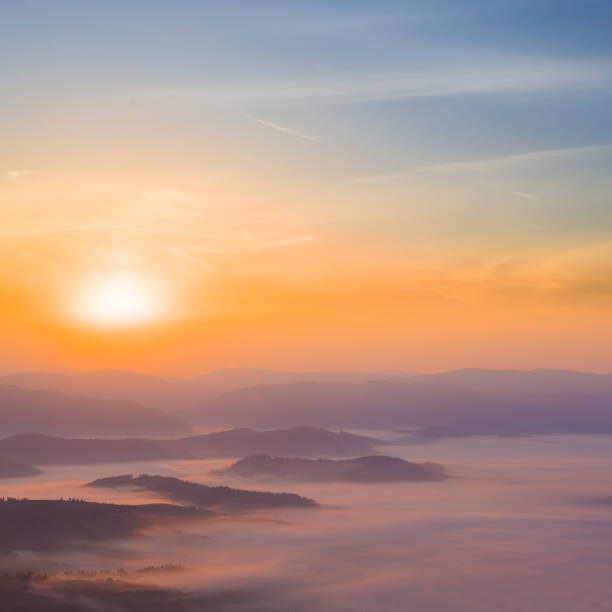 istock mountain chain silhouette in dense mist at the sunrise 2158547814