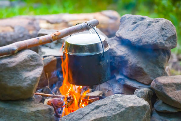 closeup touristic cauldron on a fire, summer travel scene
