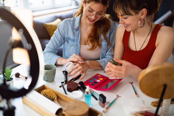istock Two young women, influencers, testing beauty products for their vlog. 2158548330